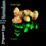 Herculean size Dragoness Egg fantasy butt plug in green and copper marble silicone glowing in the dark, handcrafted textured dragon scale anal plug.