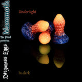 Mammoth size Dragoness Egg fantasy silicone butt plug in metallic orange and deep blue colour blend under studio light, textured dragon scale anal plug.