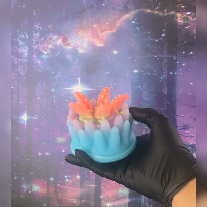 Wyrm - Ready to Ship; Turquoise base with pale pink tentacles and orange-yellow accents. The video shows its UV response and glow in the dark.