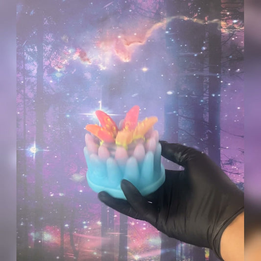 Wyrm - Ready to Ship; Turquoise base with pale pink tentacles and orange-yellow accents. The video shows its UV response and glow in the dark.